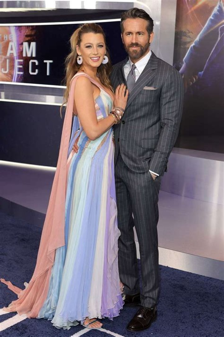 Ryan Reynolds and Blake Lively pose for photos with their newborn at